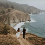 Couple walking along coastal path