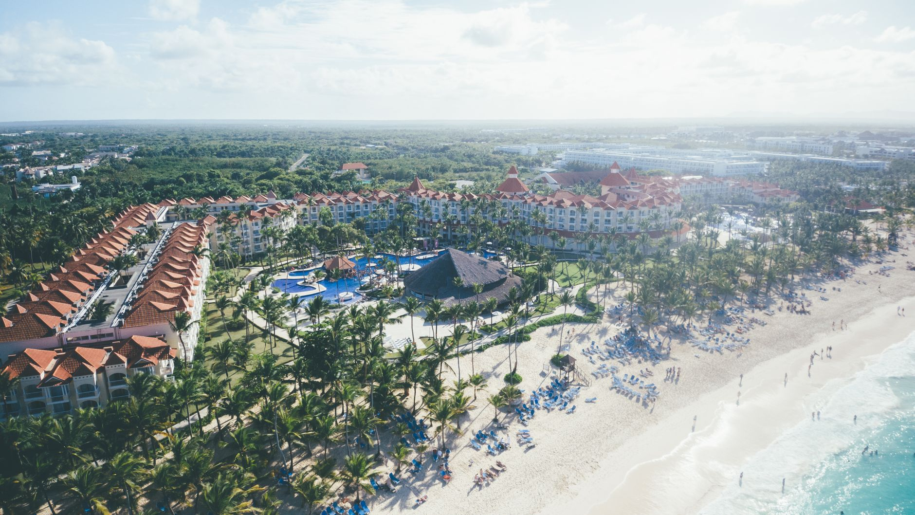 Aerial shot of tropical beach resort in Punta Cana Dominican Republic with palm trees